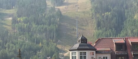 Vail Mountain and tops of Vail Square and Arabelle from the patio