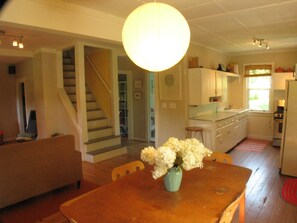 Dining room and kitchen with wood floors