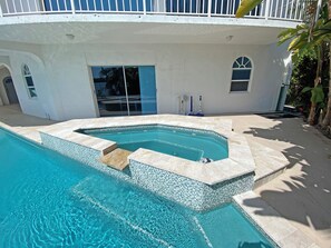small jacuzzi, overflow from this heats the pool