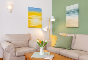 Cozy couch in the holiday apartment  Jungnamen Sand 01