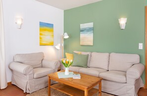 Cozy couch in the holiday apartment  Jungnamen Sand 01