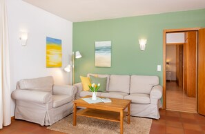Cozy couch in the holiday apartment  Jungnamen Sand 01