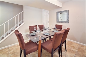 Formal dining area with comfortable seating for 6.