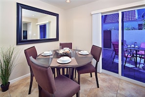 Kitchen eating area with patio access.