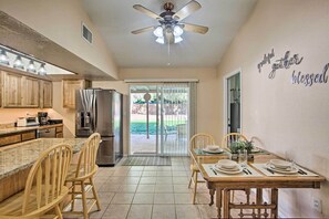 The full kitchen has granite countertops and stainless steel appliances.