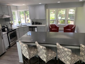 Kitchen island with view of Nook