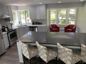 Kitchen island with view of Nook