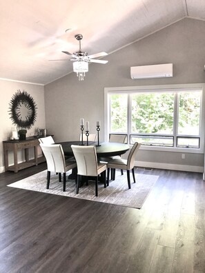 Beautiful dining area for 6 with custom windows and screens