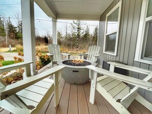 Gas firepit bowl on front covered porch