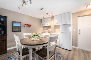Everything you need for easy meals or a takeout spread: Kitchenette with 2-burner cooktop, microwave, dishwasher, Full-size fridge, toaster, coffee maker & tea kettle