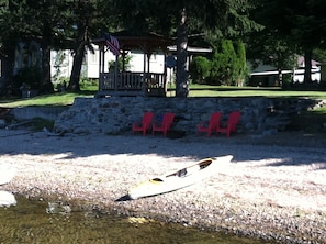 Enjoy the gazebo, sandy beach, fire pit, kayak and SUP during your stay