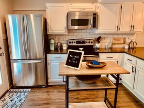 Fully stocked kitchen with quartz countertops!