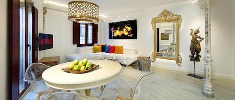 Open plan concept living room featuring a balcony with Alhambra views. 