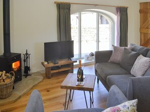 Comfy living area with wood burner | Spindle Well Barn, Elsdon, near Otterburn