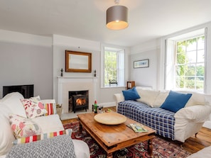 Stylishly furnished living room with wood burner | Colveston Manor, Mundford