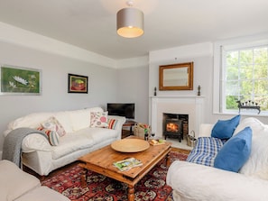 Stylishly furnished living room with wood burner | Colveston Manor, Mundford