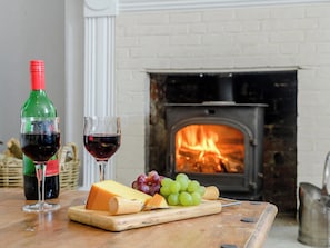 Stylishly furnished living room with wood burner | Colveston Manor, Mundford