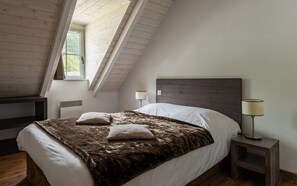 The master bedroom features a cozy Double bed.