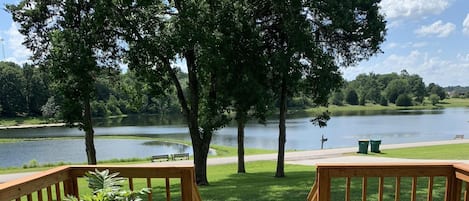 Enjoy sunsets on Master bedroom porch; fire pit and chairs 