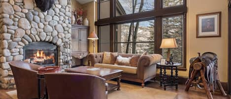 Stunning living room with wood burning fireplace.