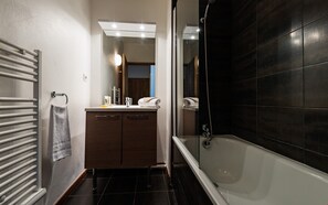 Get ready for your day in the lovely bathroom.