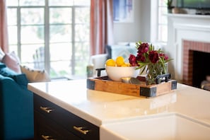 Large 9 foot marble island, looking from kitchen into living room.