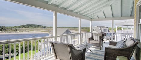 Relax on your porch and enjoy 180 degree views of the beach, ocean and sunsets