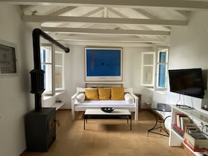 Living room with wood stove, view towards the south