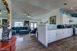 Entry showing the Kitchen to the right and living room