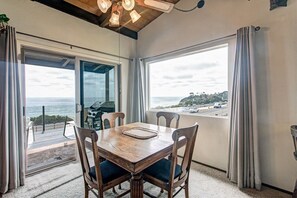 Dining area with views of the ocean. THE BBQ HAS BEEN REMOVED.