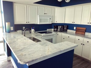 Fully renovated kitchen; electric stove.