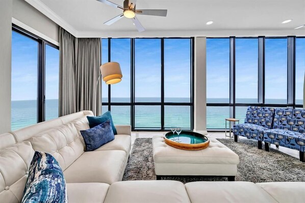 Relax and enjoy the view from the gorgeous living room in this penthouse.