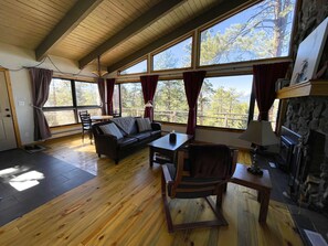 Open floor plan with beetle-kill wood floors