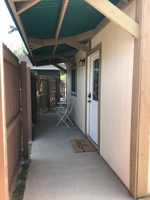 Showing the walkway up to the front door, looking North.