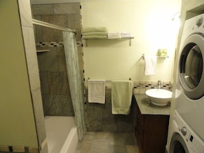 Beautiful bathroom with full size washer and dryer