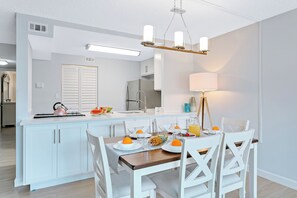 Stylish dining area with a six-chair table, perfect for meals and gatherings