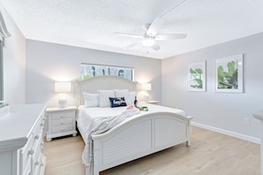 Master bedroom featuring a cozy king-size bed for ultimate comfort