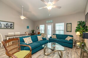 Versatile living area featuring a harmonious blend of comfort and style, ideal for both relaxation and entertaining