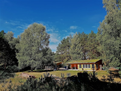 Holiday homes on a natural plot with a private beach on Lake Zootzensee