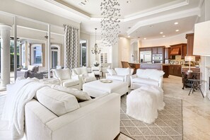Living room with fireplace and open kitchen