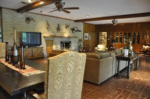 Living room with over sized coach that seats 10 or sleeps 3, dining for 10  