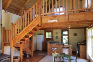 dining and kitchen showing upstairs bedroom
