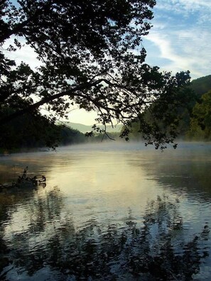 Fog lifting off river early morning
