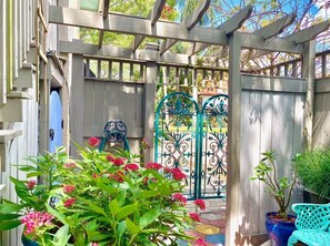 Inside court yard with arbor overhead. 