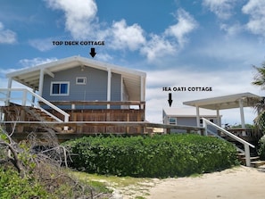 The two cottages are connected by a large deck