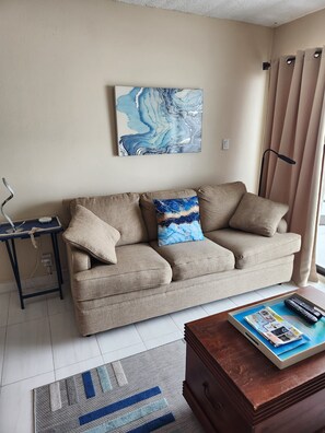Sofa bed to relax watching the waves or TV.