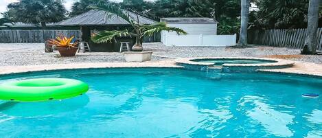 Private pool and tiki bar in the backyard