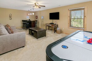 The basement game room and bar area is the perfect place to unwind.