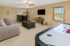 The basement game room and bar area is the perfect place to unwind.