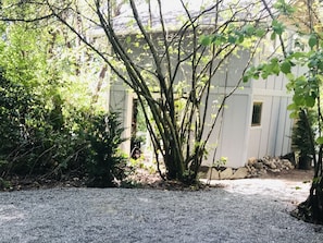 The parking area and walkway to the cabin. 
